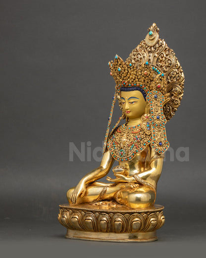 Left side view of Jowo Shakyamuni Buddha showing detailed jewelry and sacred posture