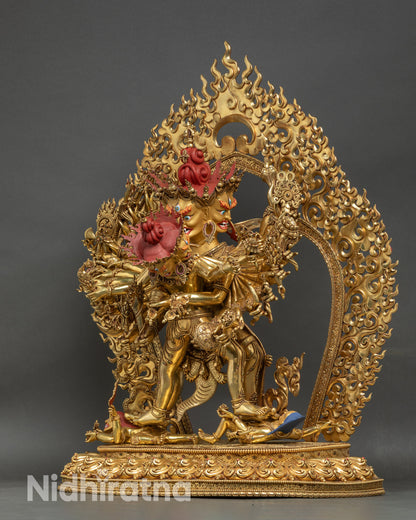 Left side view of Kalachakra Statue, detailed arms and ritual attributes visible