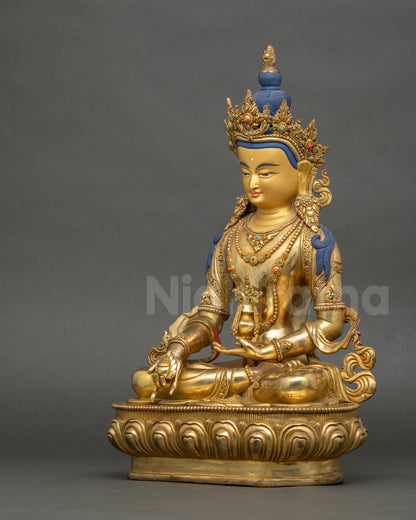Left side view of Kshitigarbha Bodhisattva statue with ornate jewelry and patterns