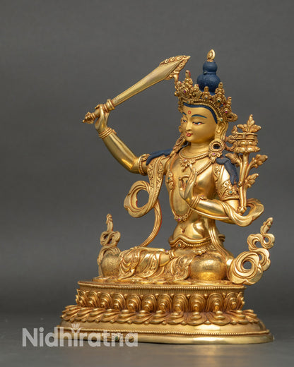 Left side view of Manjushri Sculpture with sword and utpala flower details