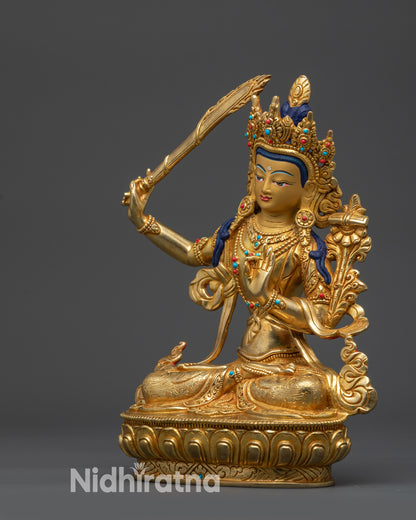 Left side view of Manjushri Statue detailed robes and gold-gilded finish