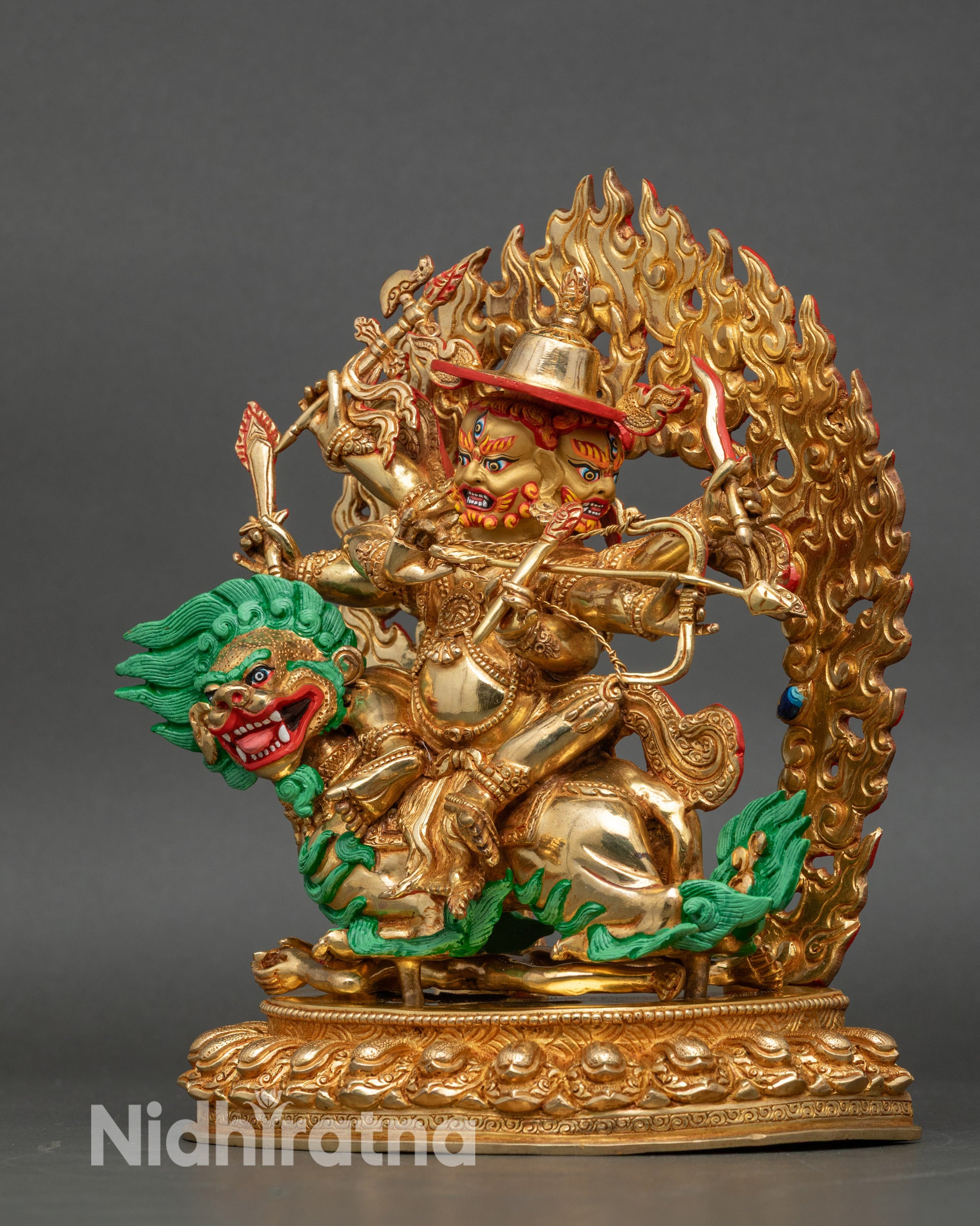 Left side view of Pehar Gyalpo Dharma protector statue with flaming halo