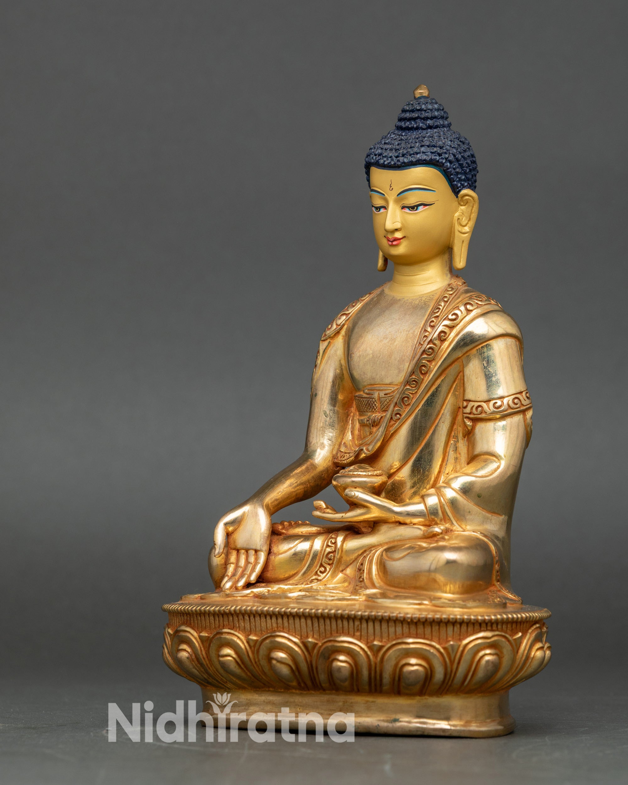 Left side view of Ratnasambhava Buddha, copper sculpture with 24K gold fire-gilding