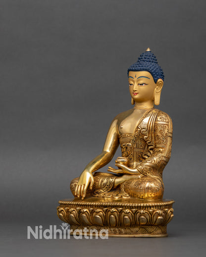 Left side view of Shakyamuni Buddha statue, intricate copper and gold carvings