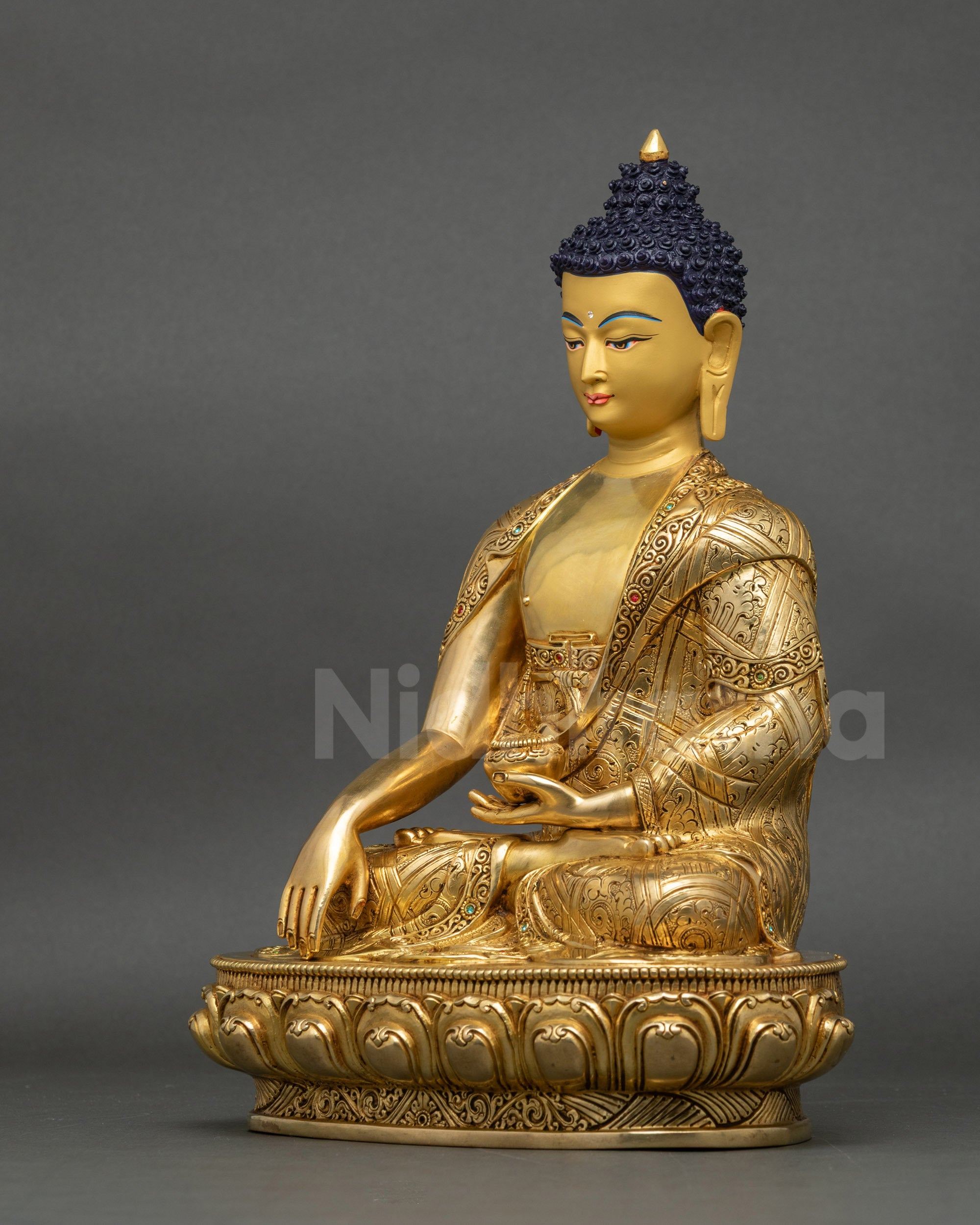 Left side view of Shakyamuni Buddha statue showing Begging Bowl and lotus seat details