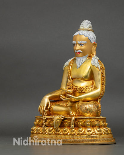 Left side view of Thangtong Gyalpo statue, detailed robes and artisan carving