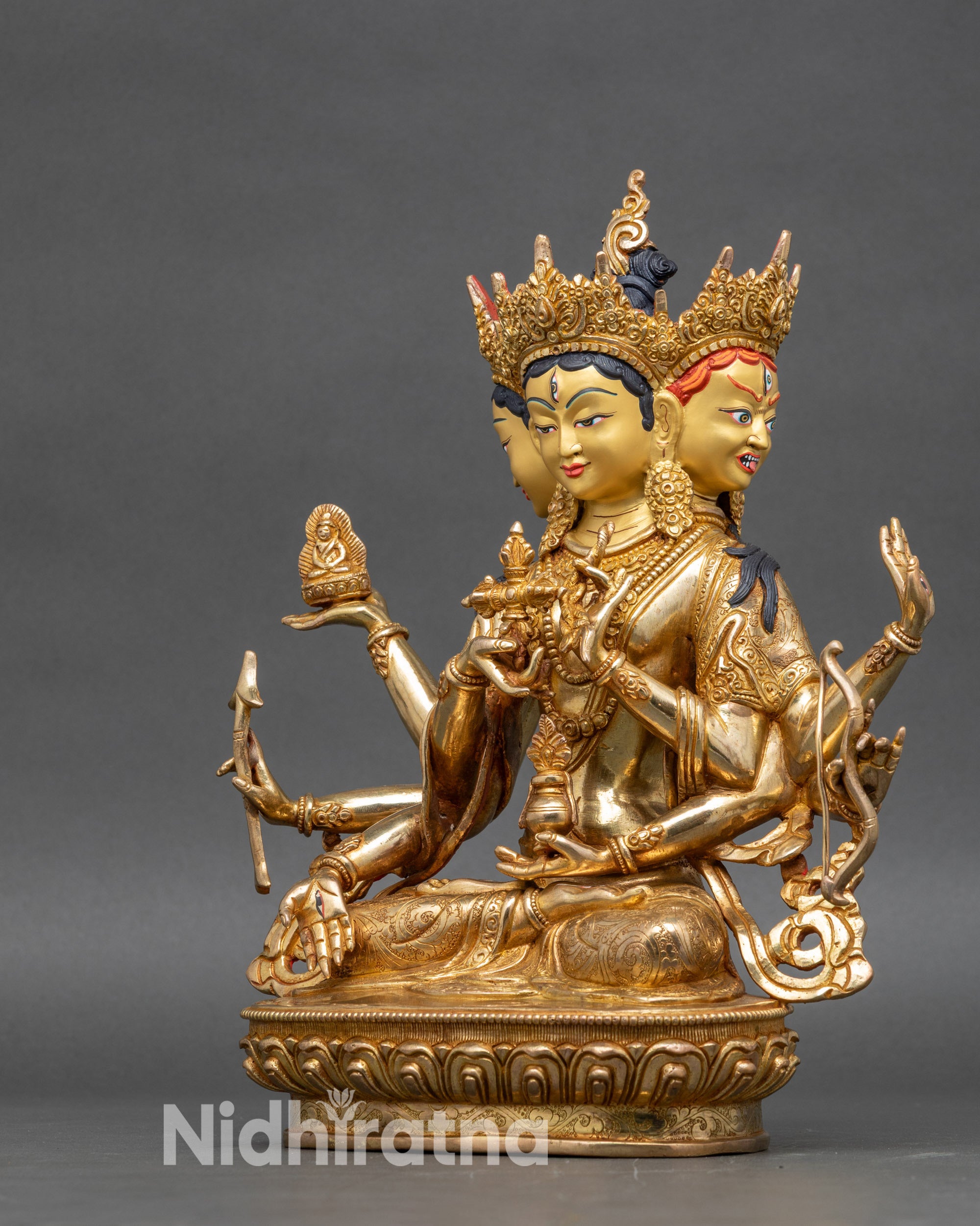 Left side view of Ushnishavijaya statue with ornate crown and sculpted drapery