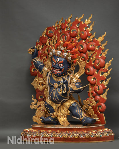 Left side view of Vajrapani statue highlighting copper craftsmanship and gilding