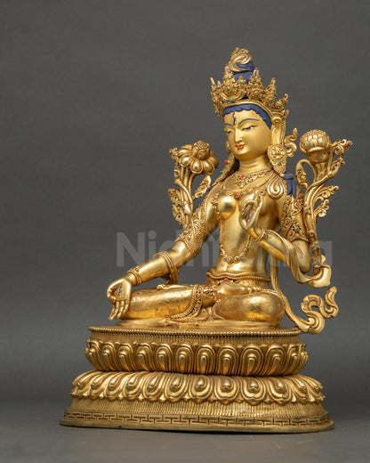 Left side view of White Tara Statue showing Varada and Vitarka mudras