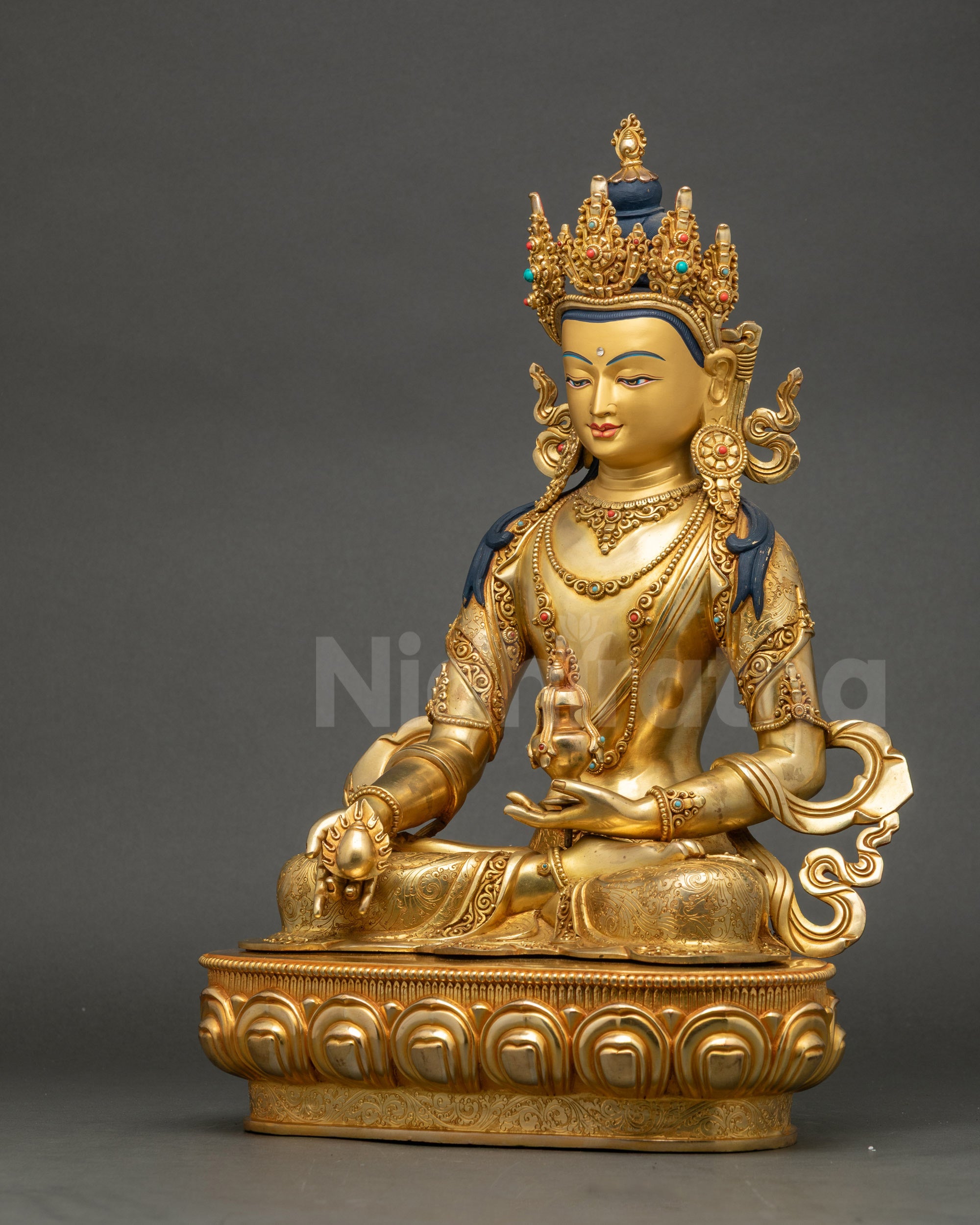 Left side view of handmade Jizo Kshitigarbha statue with jeweled crown and vase