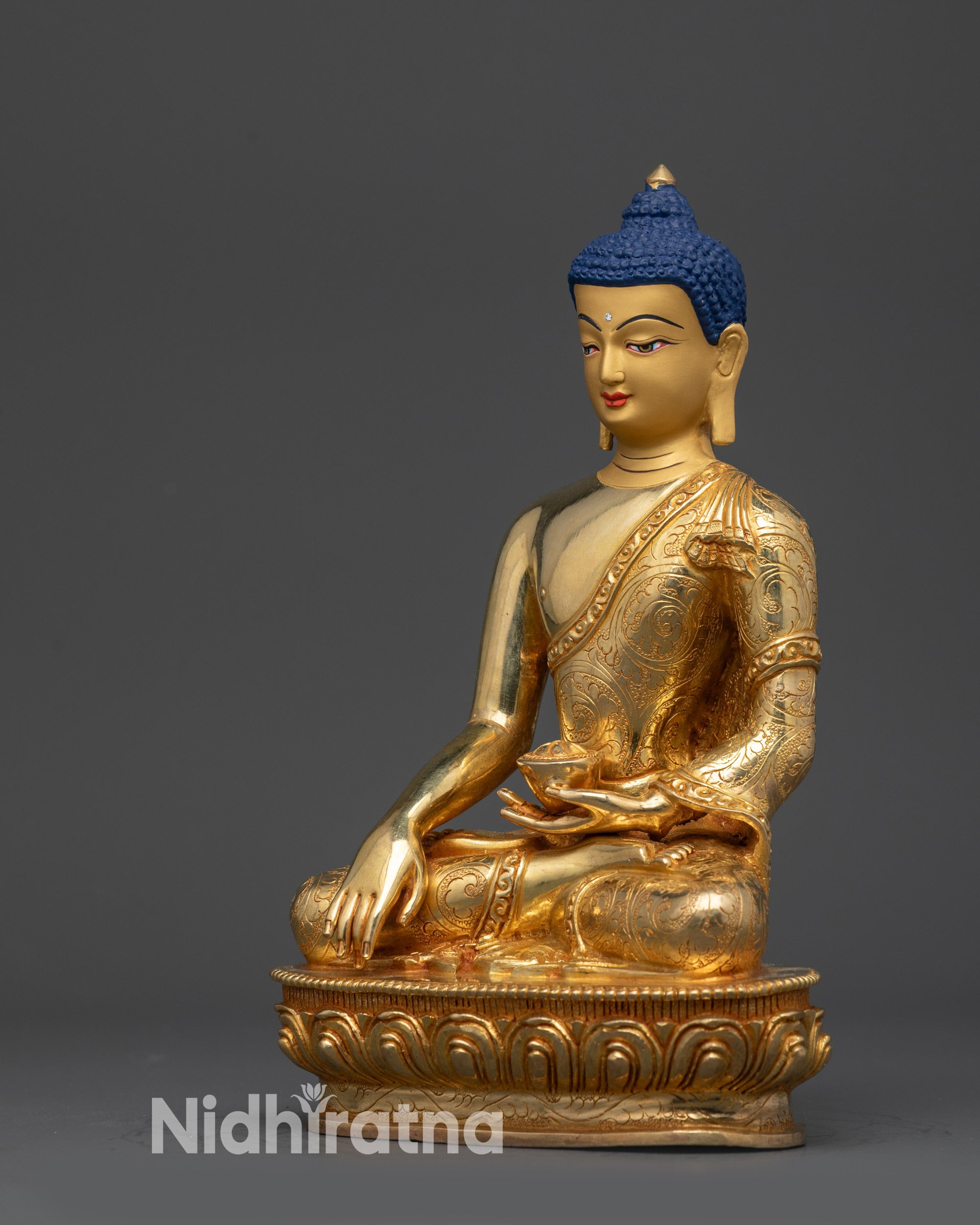 Left side view of the hand-carved Nepalese Buddha statue in meditation.
