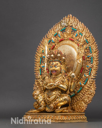 Left view Chaturbhuja Mahakala statue with dynamic robes and flame halo.