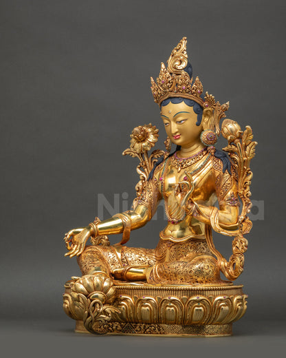 Left view of Green Tara statue emphasizing lotus seat and divine hand gesture
