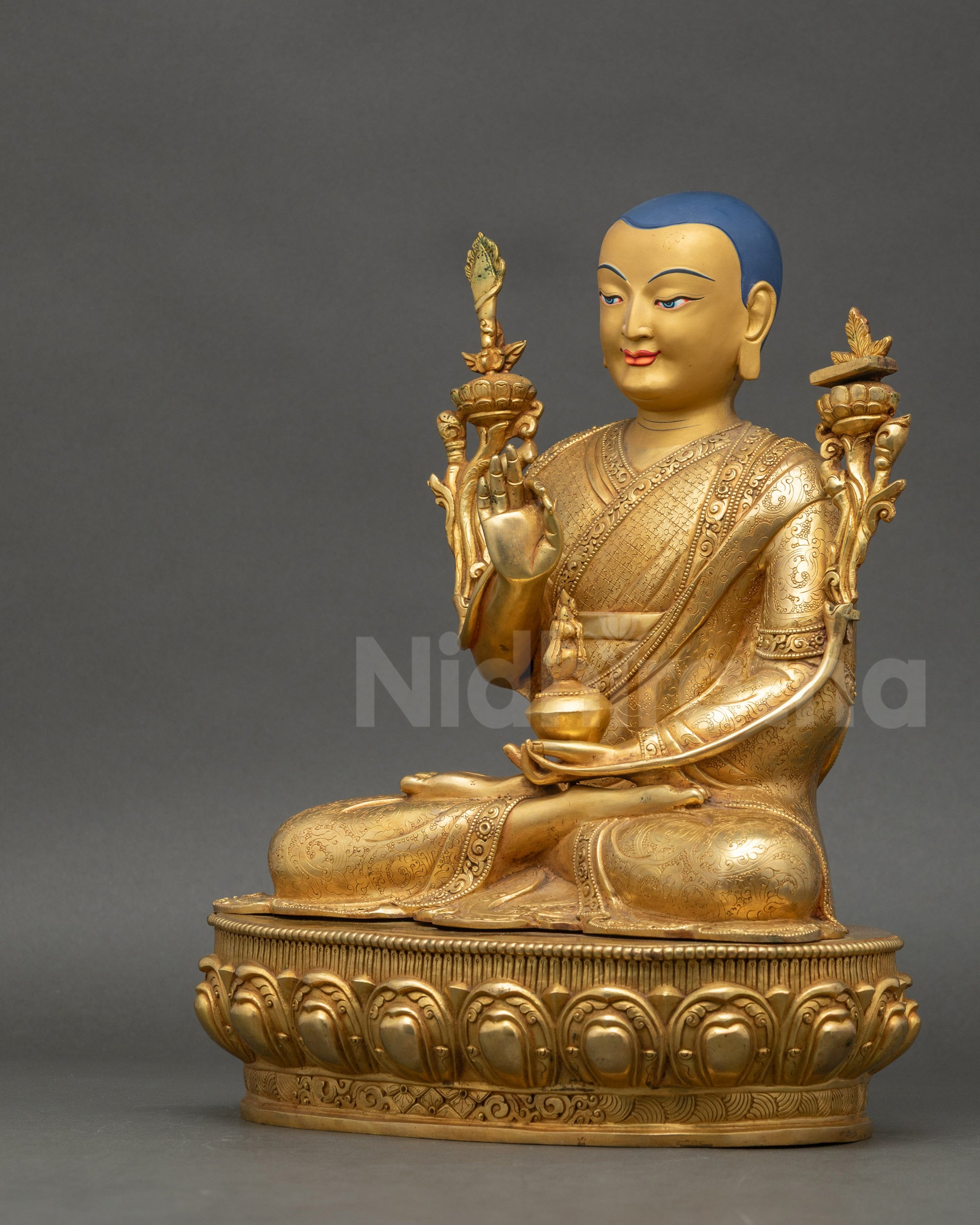 Left view of Je Tsongkhapa statue holding utpala stem in abhaya mudra