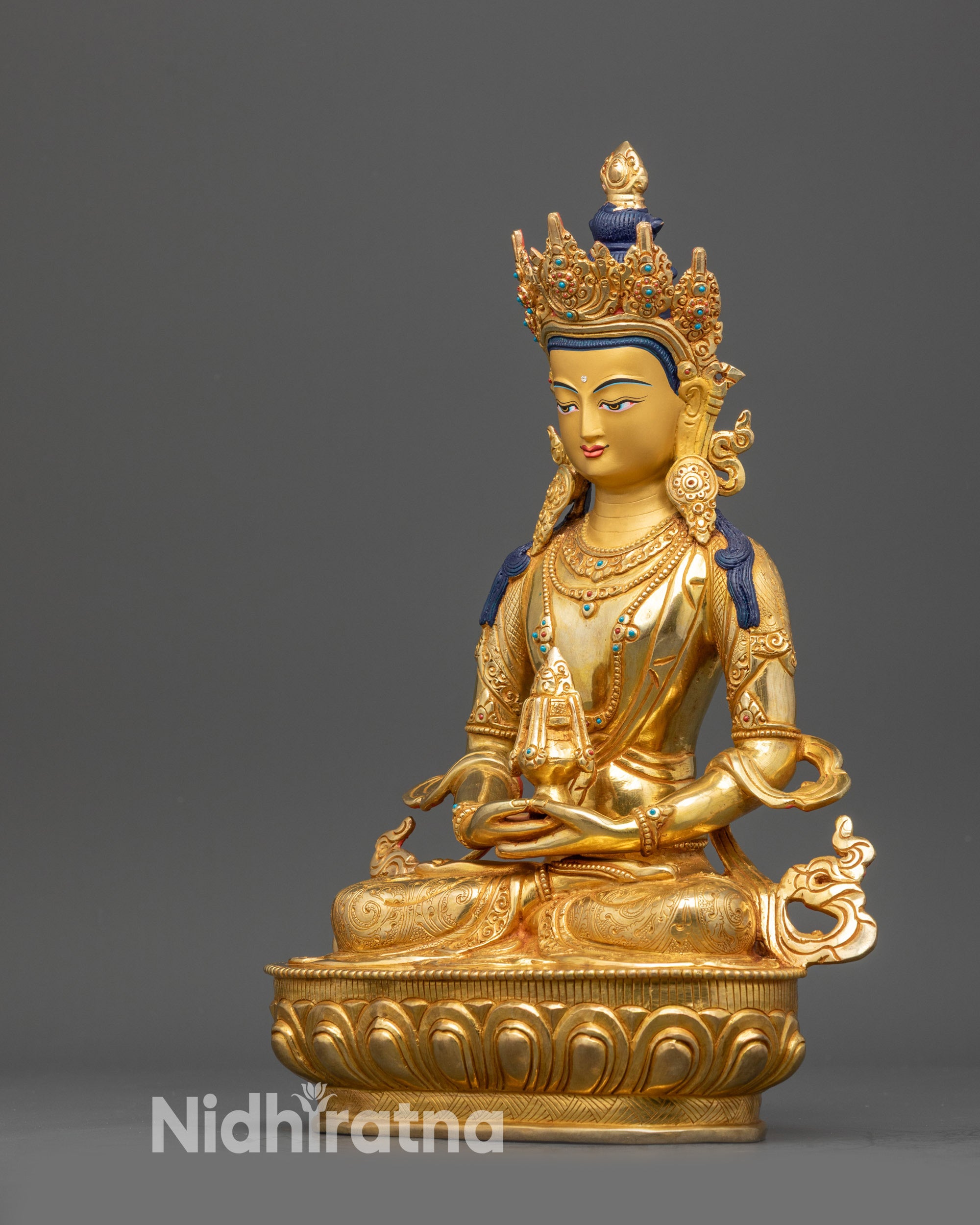 Left view side Amitayus Tibetan Buddha statue with crown jewelry and flowing robes
