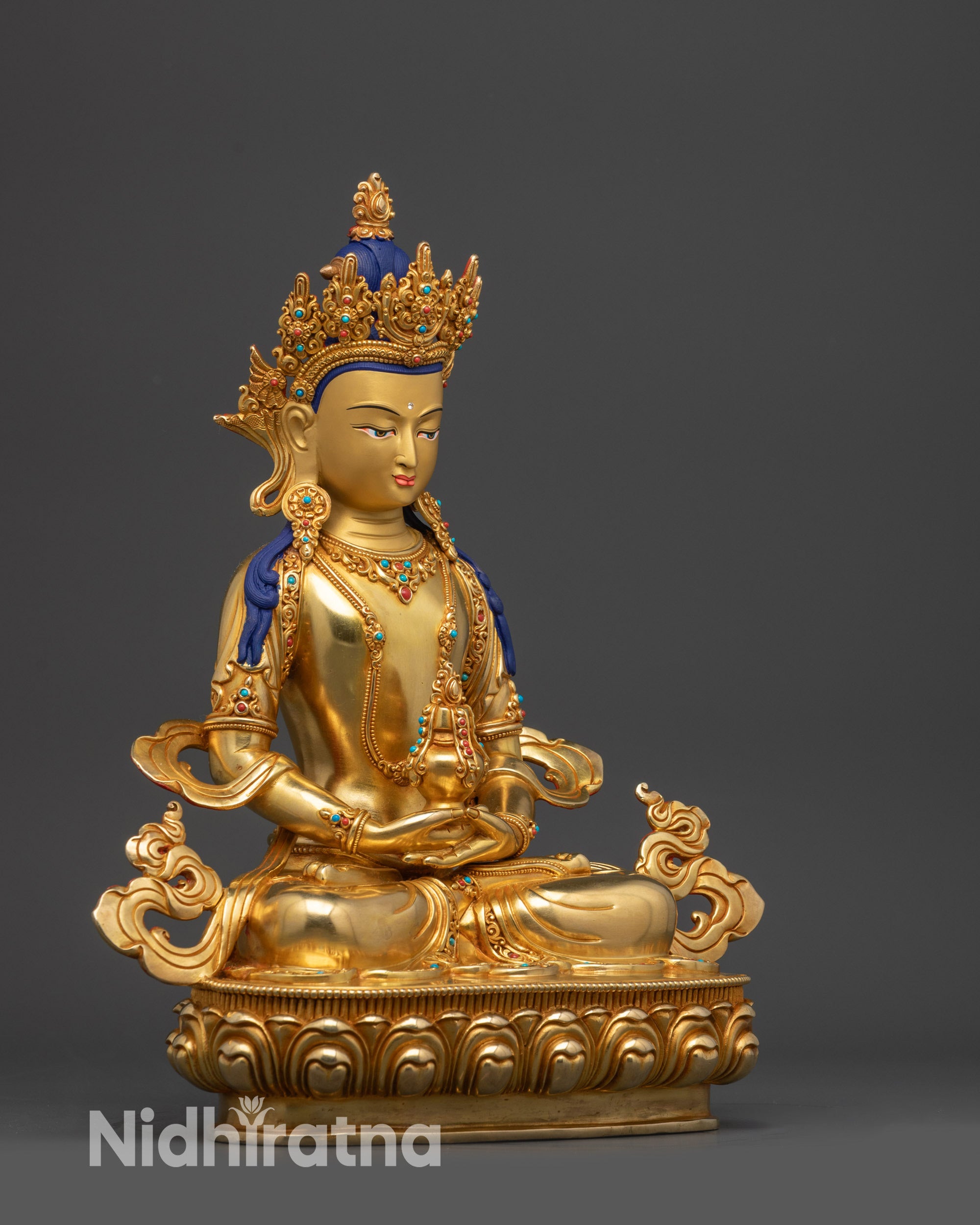 Left view side Amitayus holding long-life vase with gold-gilded robe and jewelry details
