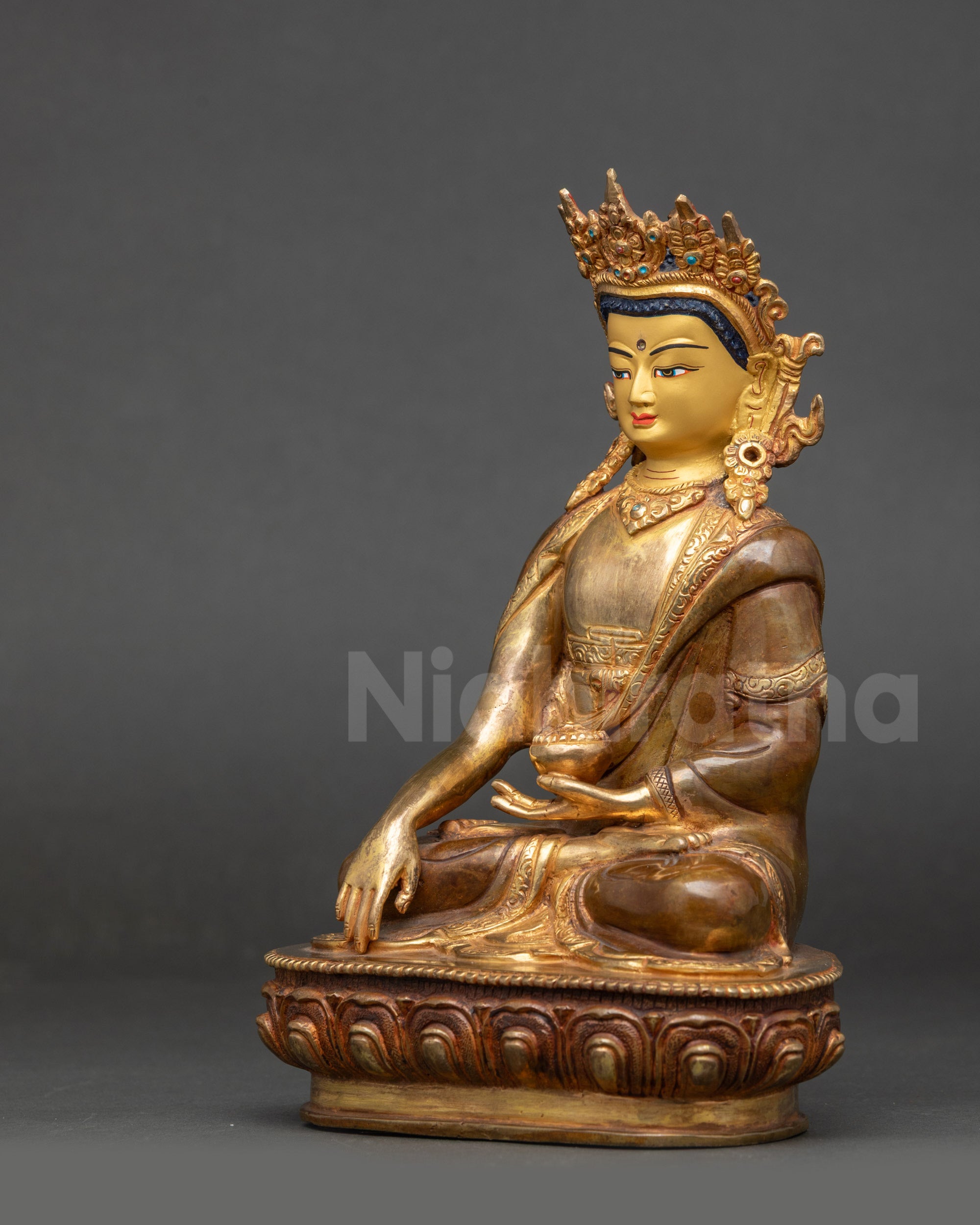 Left view side Buddha Shakyamuni Statue with crown, earrings, and seated posture
