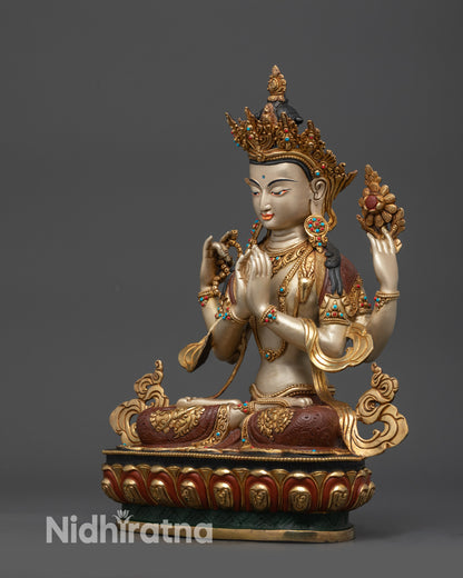Left view side Chenrezig Bodhisattva statue in meditation with gold robe and semi-precious stones
