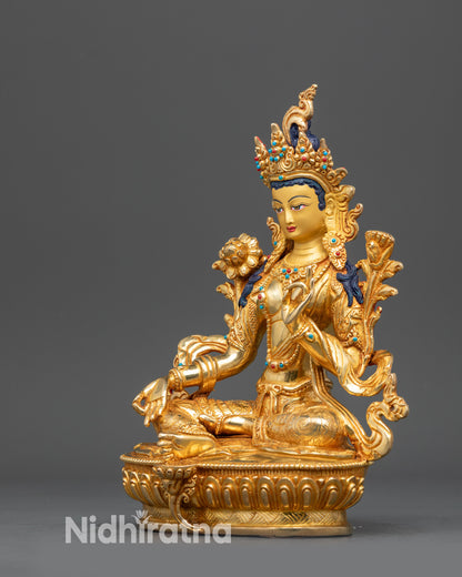 Left view side Green Tara Tibetan sculpture with flowing robes and ornaments
