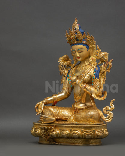 Left view side Green Tara statue displaying Vitarka mudra and floating robe
