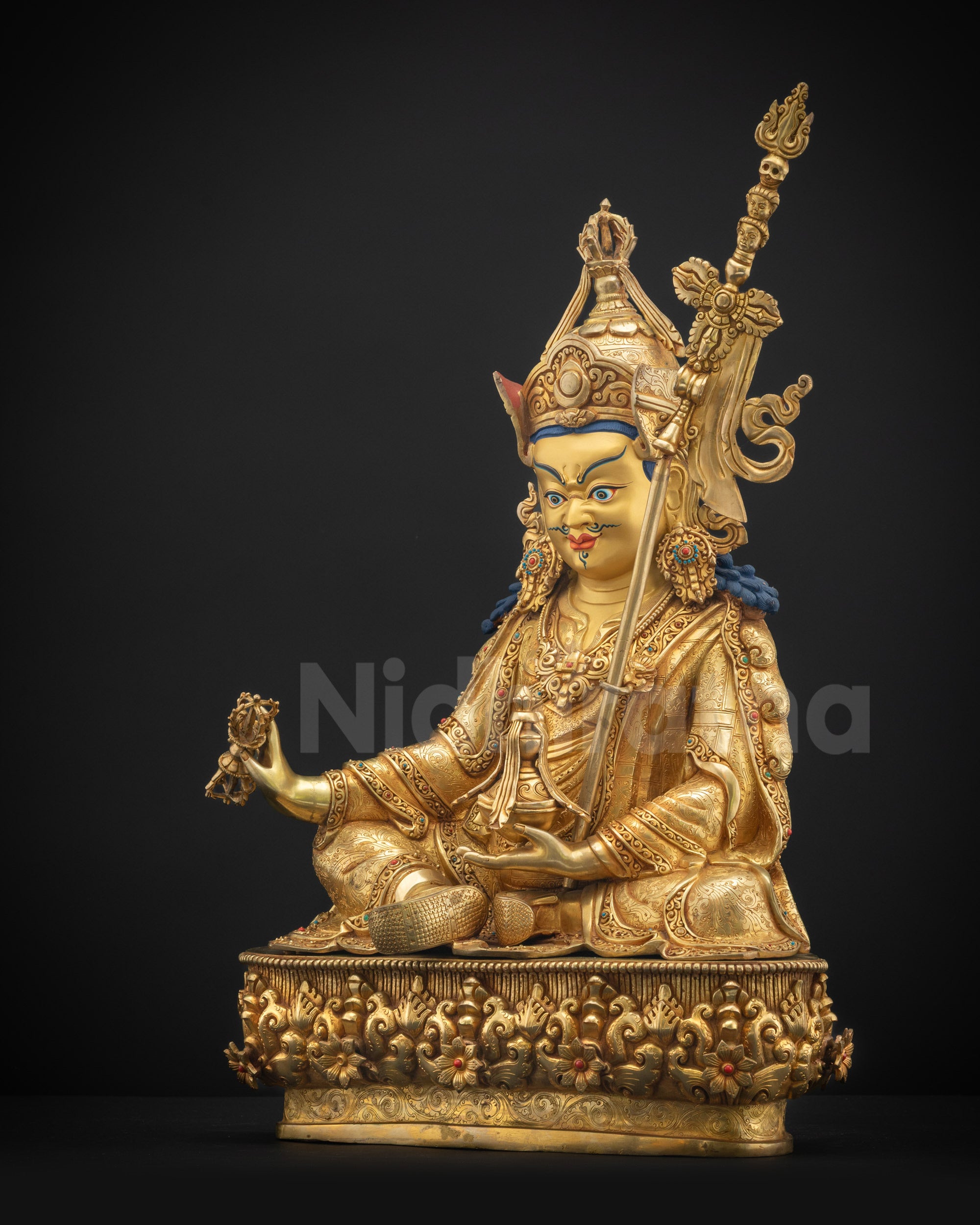 Left view side Guru Rinpoche statue with layered gold fire-gilding