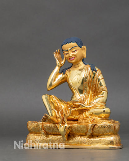 Left view side – Left profile of Milarepa statue highlighting seated posture and flowing robes