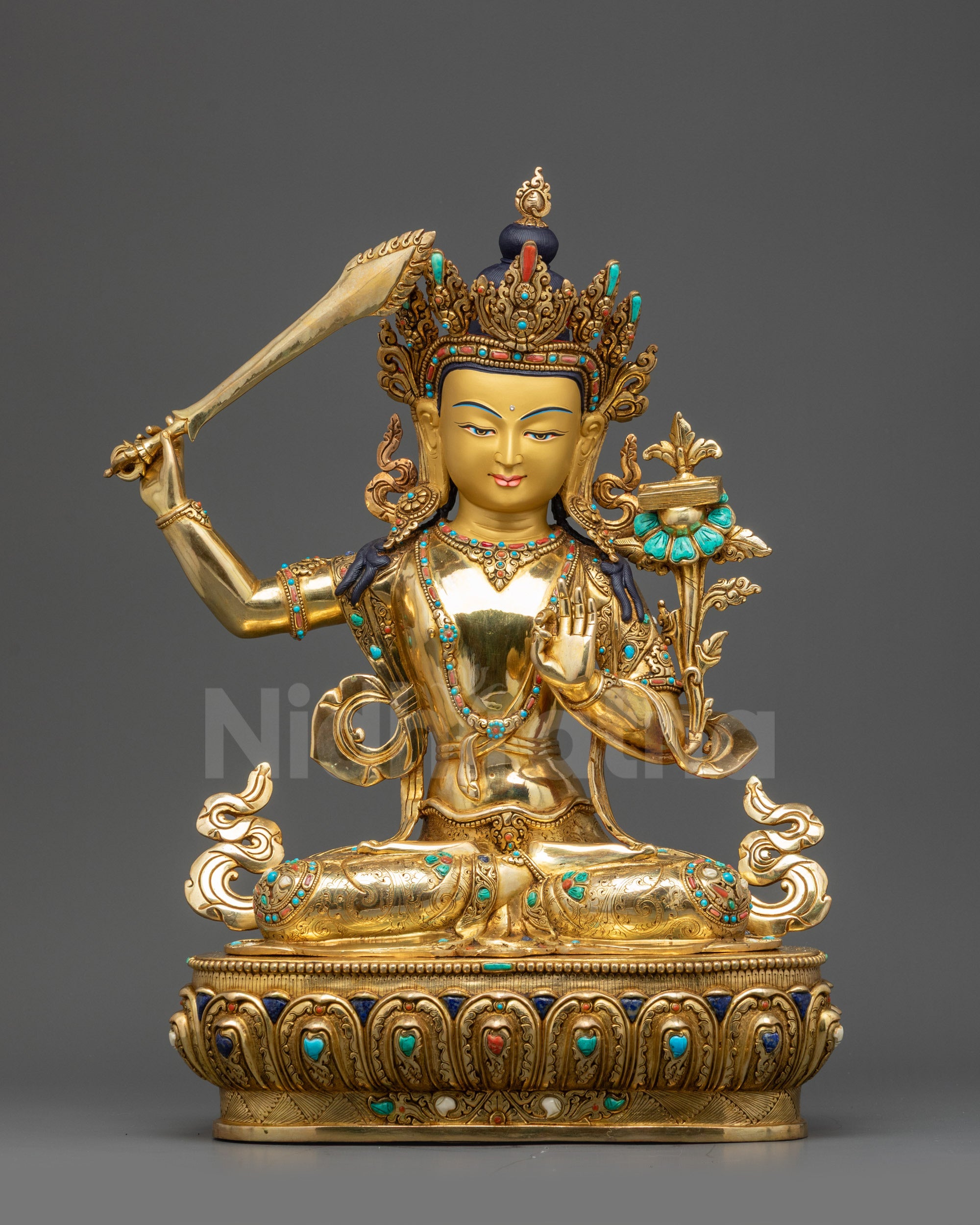 Left view side Manjushri Statue showing Abhaya Mudra, flowing garments and lotus throne
