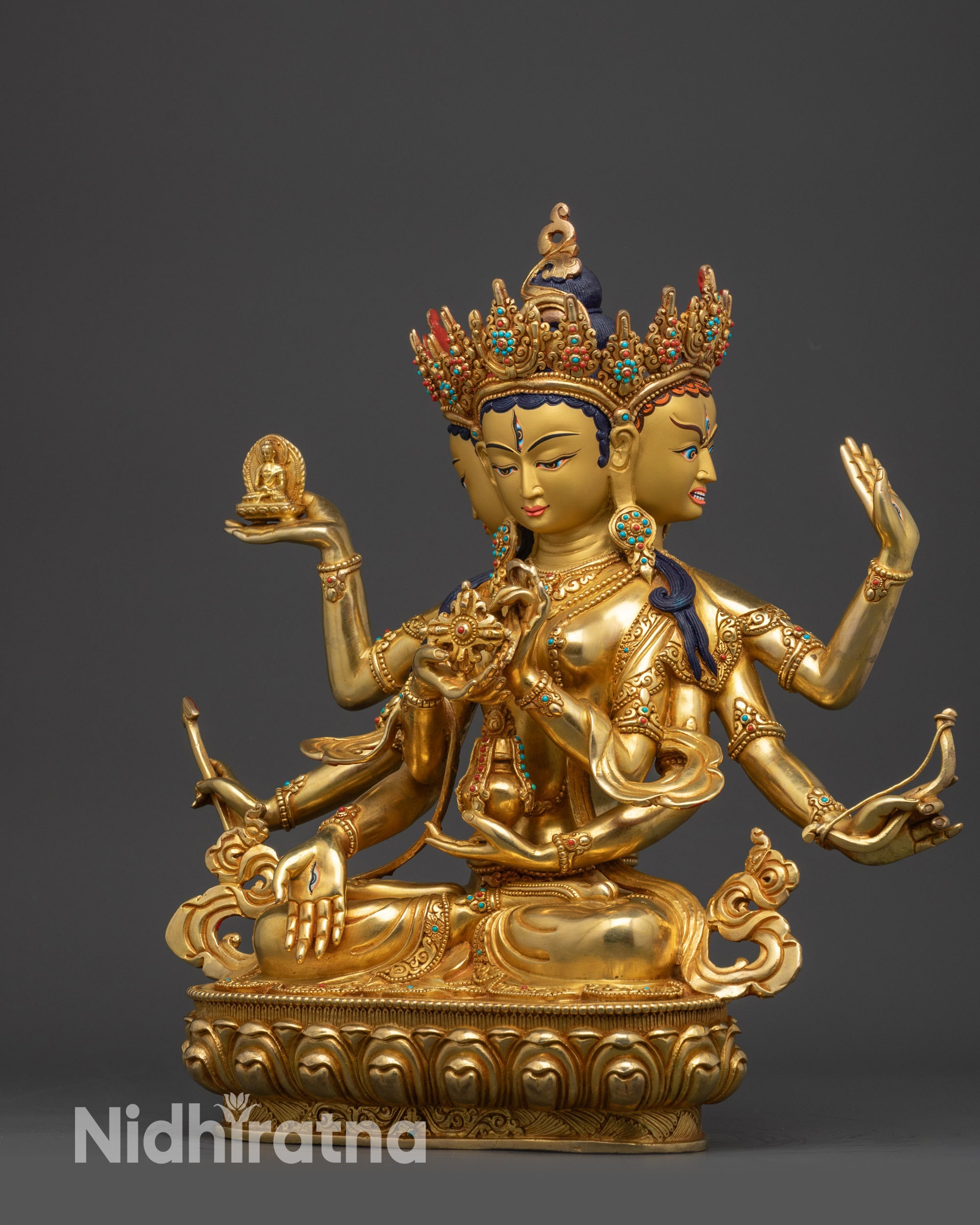 Left view side Namgyalma holding sacred objects with elaborate gold-gilded ornaments

