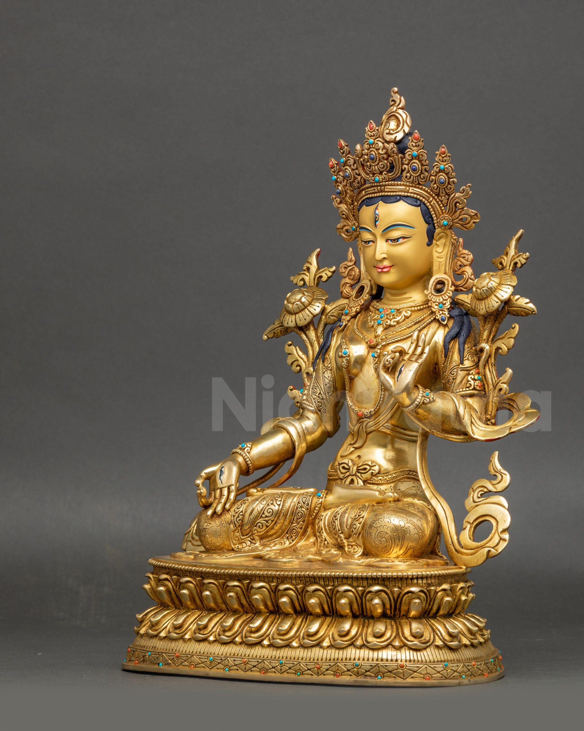 Left view side White Tara statue highlighting crown and floating robe craftsmanship