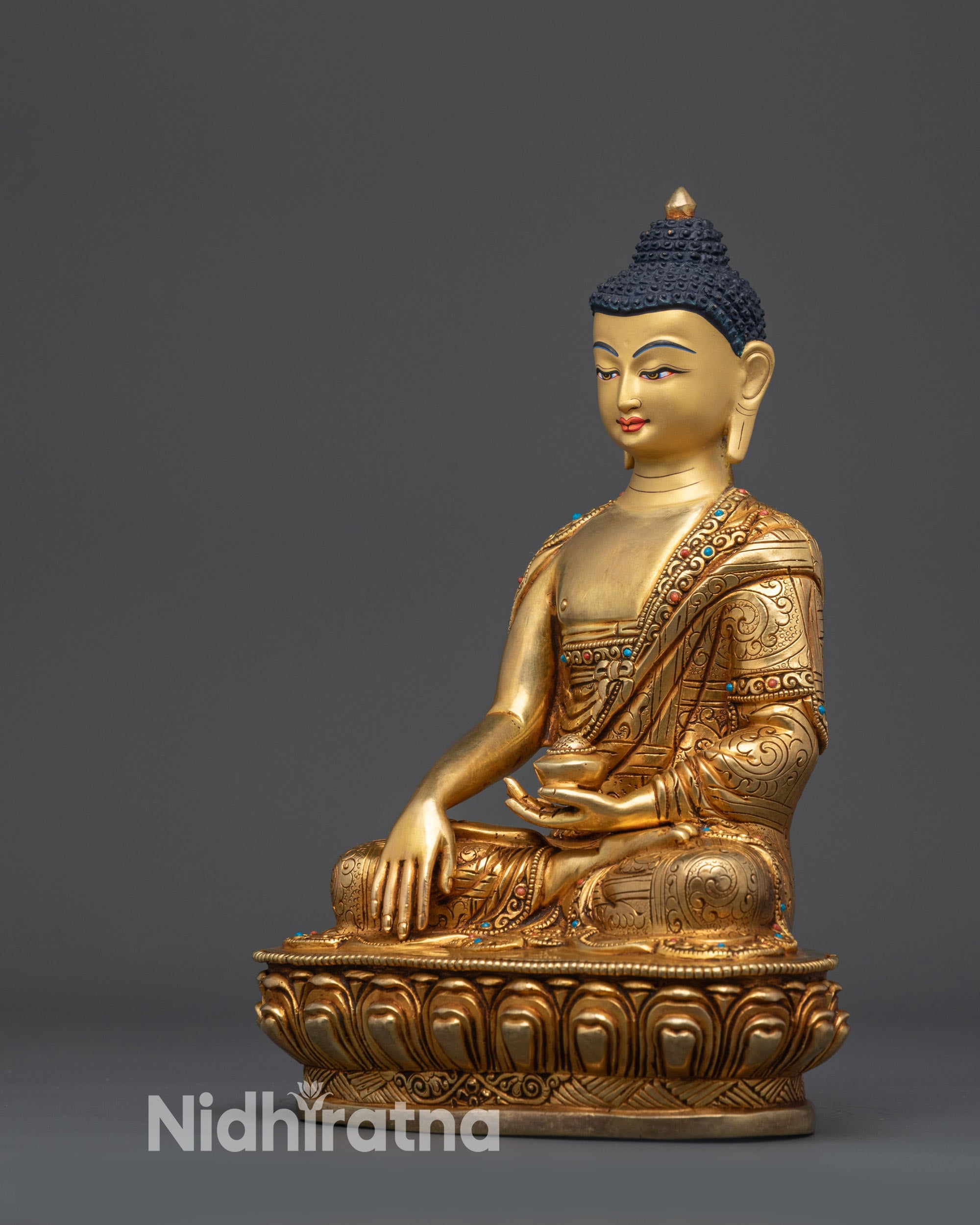 Left view side of Bodhi Shakyamuni Buddha highlighting robe and lotus base details
