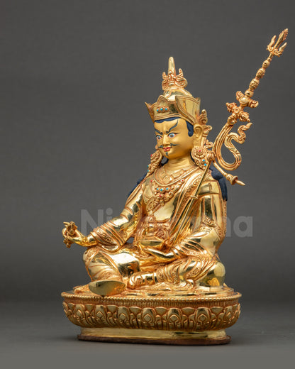 Left view side of Guru Rinpoche Statue showing skull cup and flowing robes