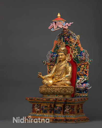 Left view side of Guru Rinpoche statue with disciples Yeshe Tsogyal and Mandarva on throne
