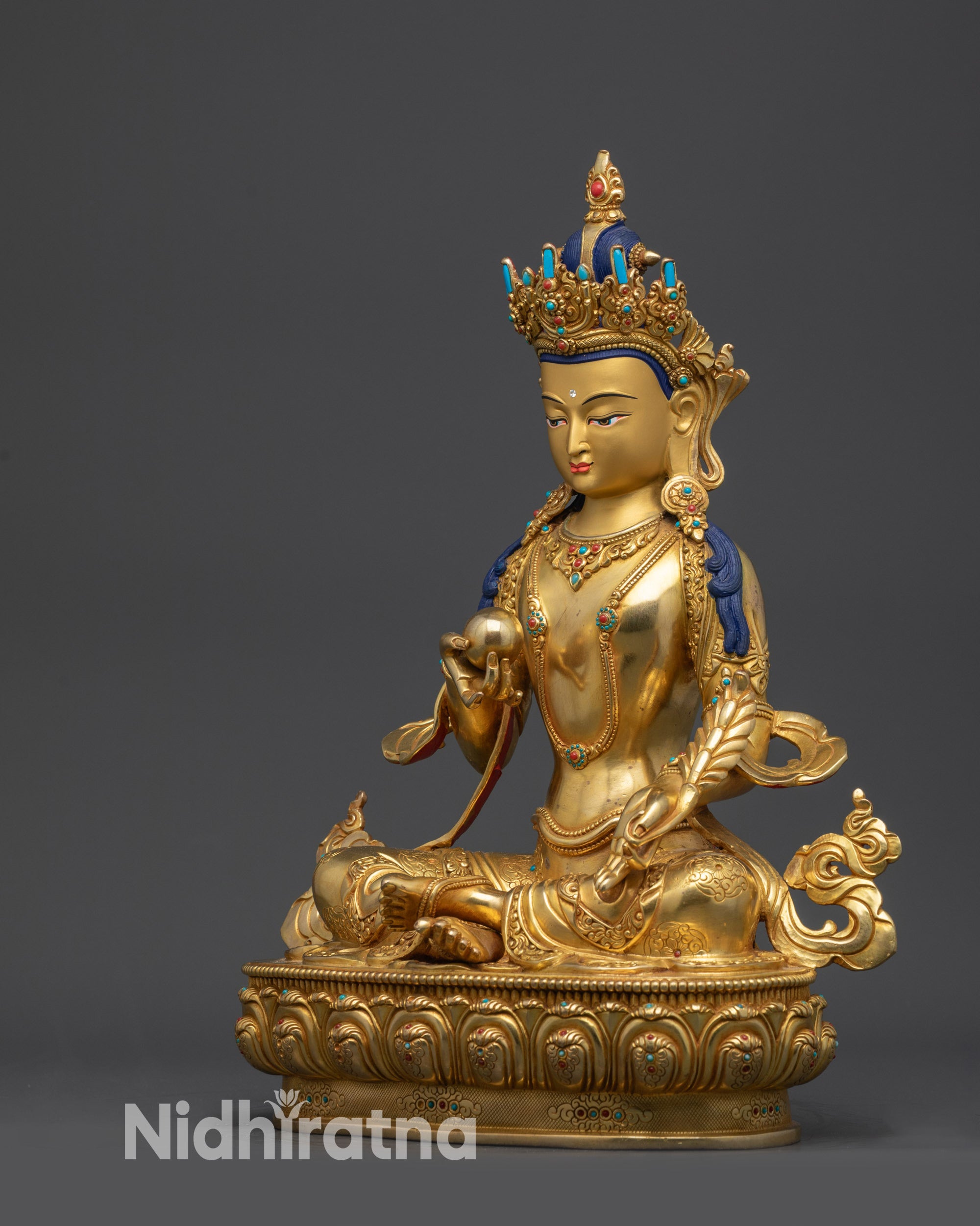Left view side of Kshitigarbha Bodhisattva statue showing intricate robe and crown
