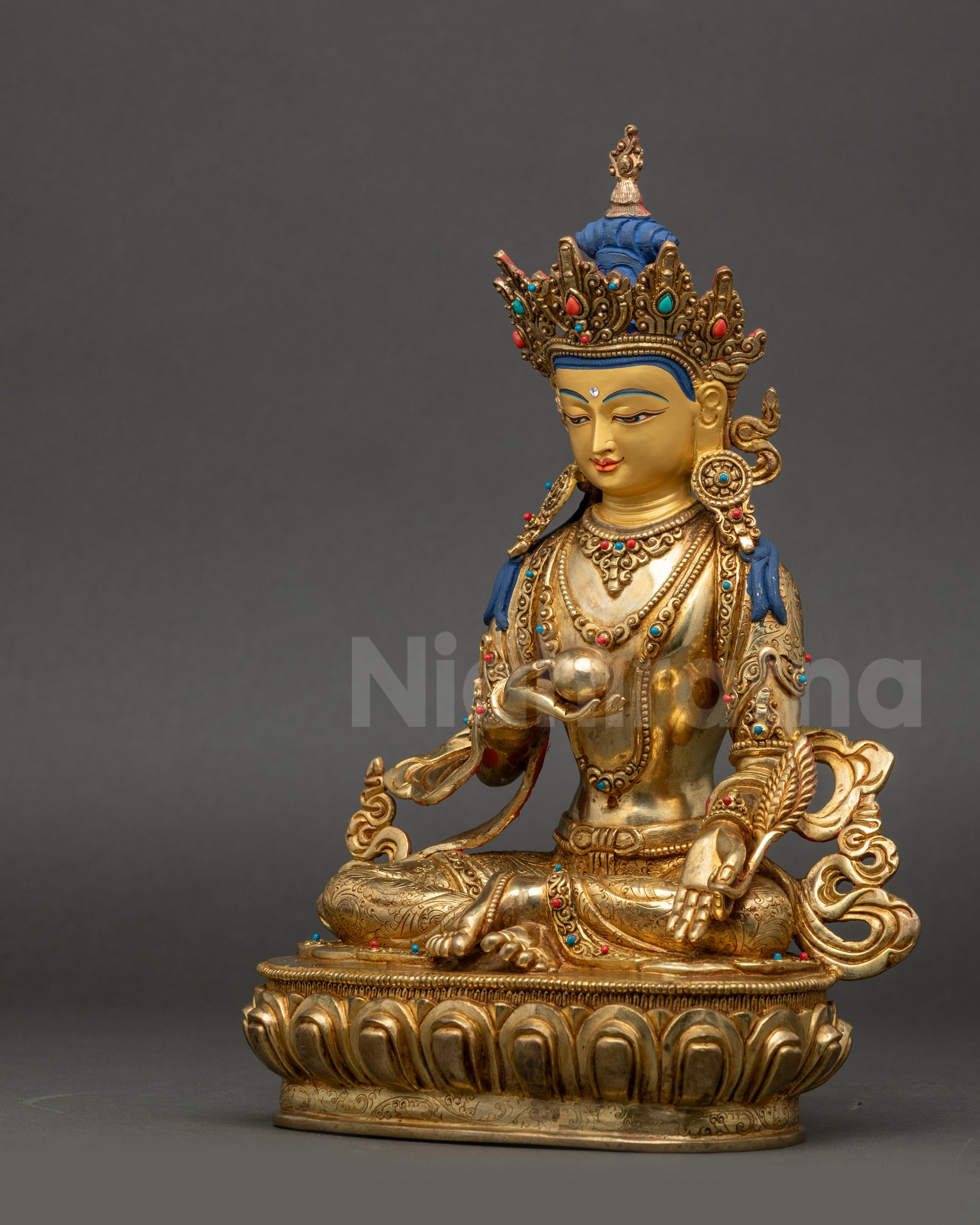 Left view side of Ksitigarbha statue adorned with crown and semi-precious stones