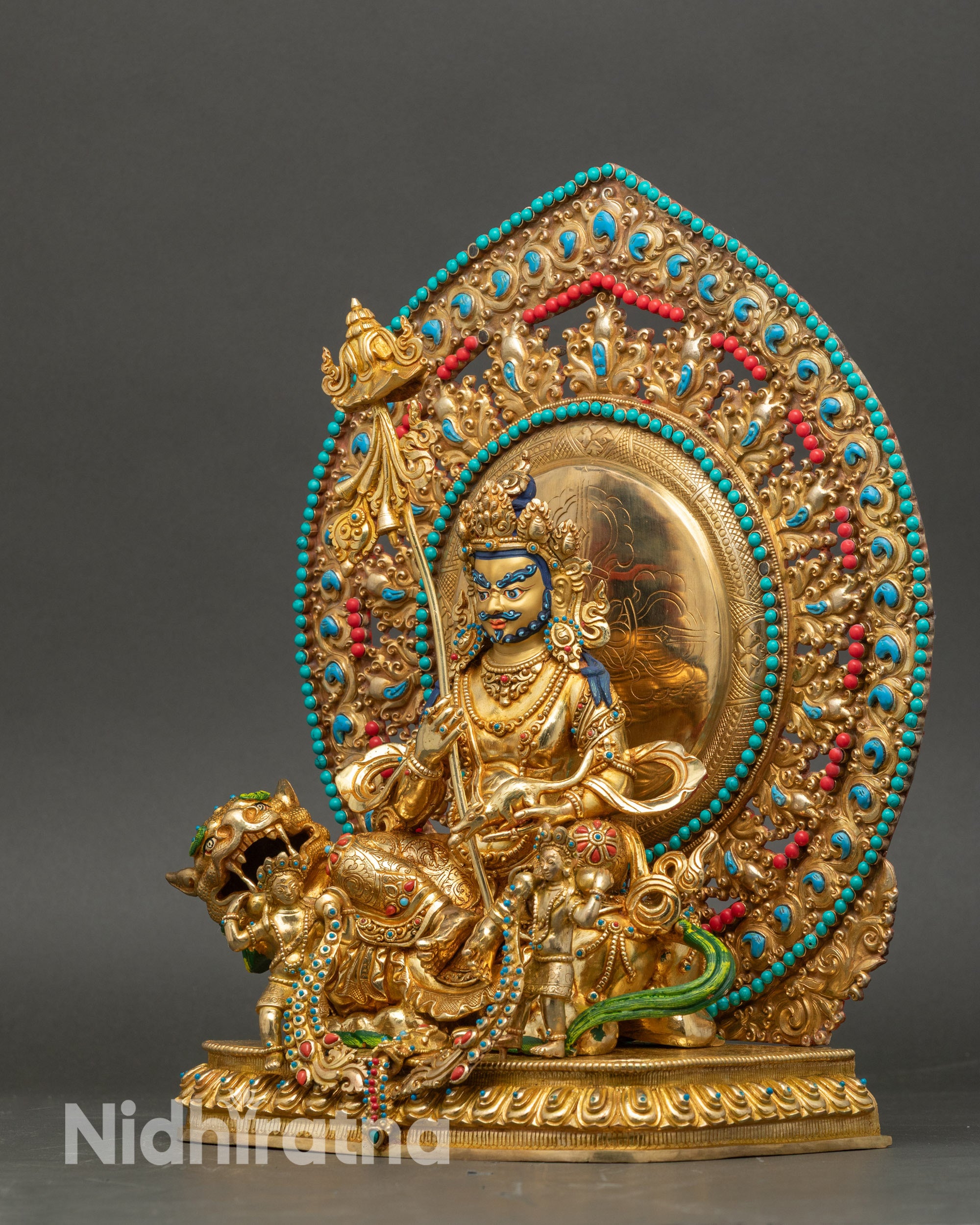 Left view side of Namtoshe Statue with flowing robe and lotus seat details