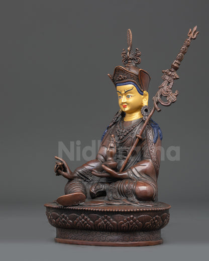 Left view side of Nepalese Guru Padmasambhava statue with intricate robes