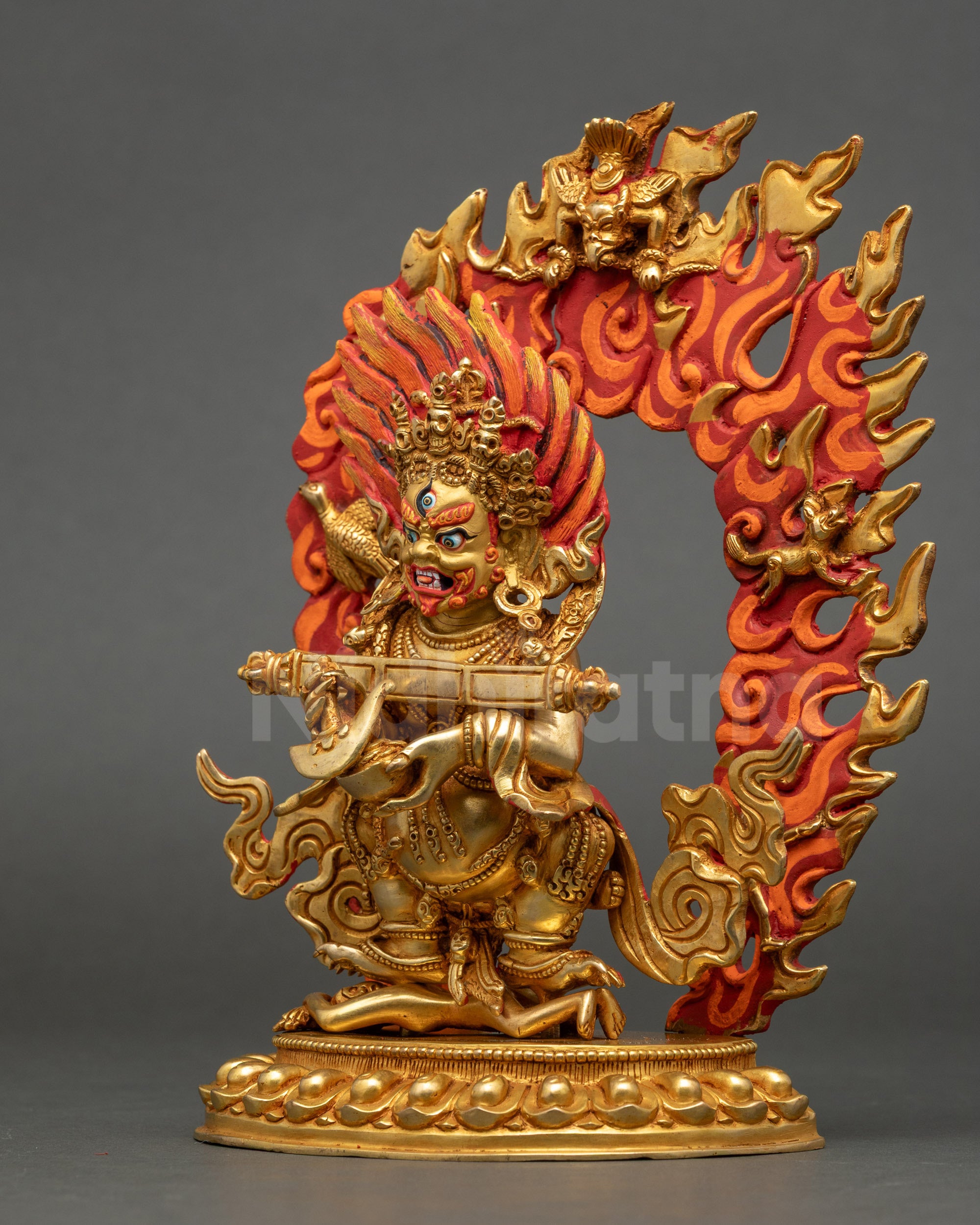 Left view side of Shakya Mahakala protector deity on lotus with Kapala and Kartika knife
