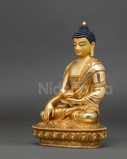 Left view side of Shakyamuni Buddha Figure showing Bhumisparsha mudra and gold finish