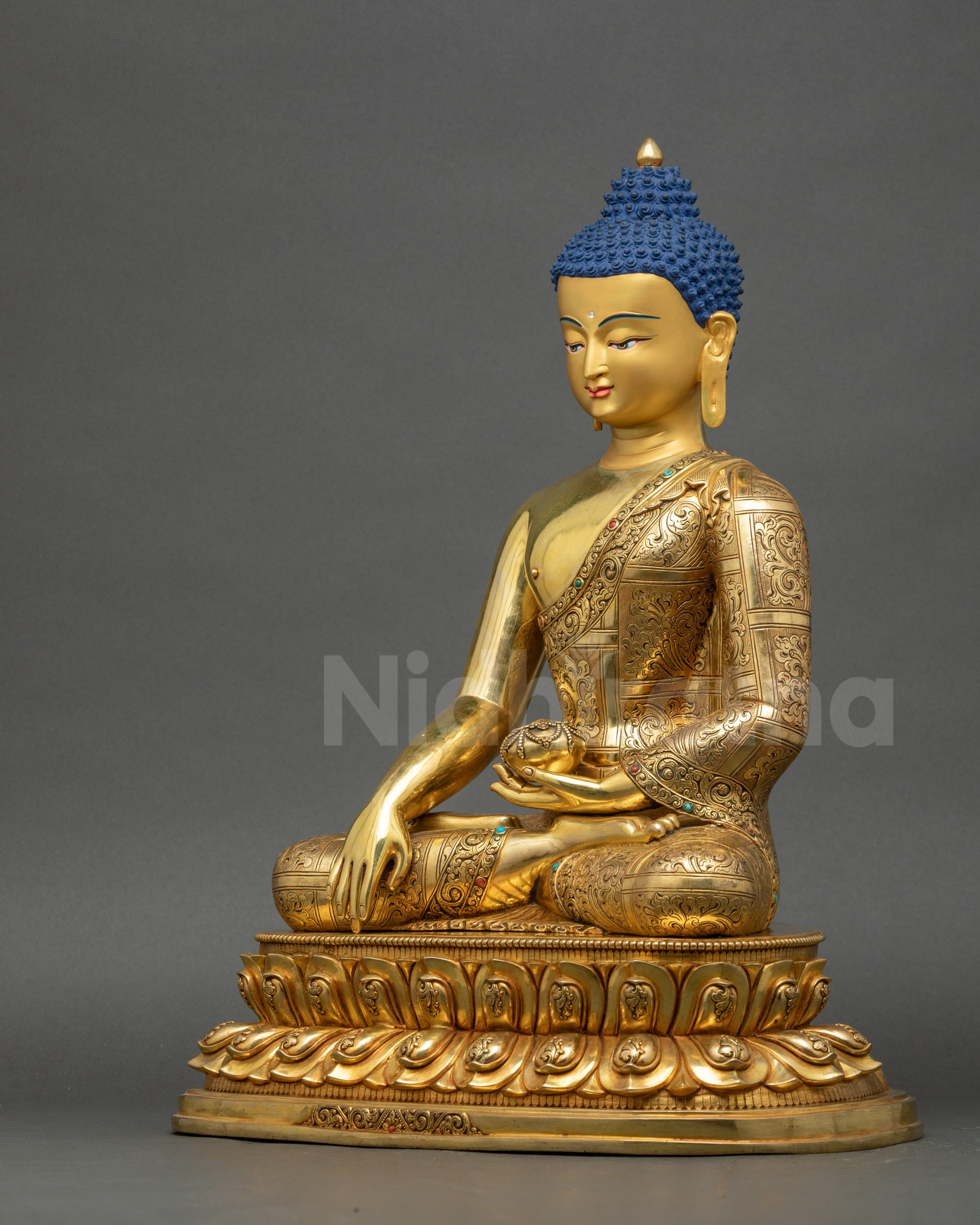 Left view side of Shakyamuni Buddha Sculpture showing patra bowl and intricate robe carvings