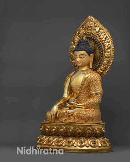 Left view side of Shakyamuni Buddha statue with gold fire-gilded base and lotus pedestal
