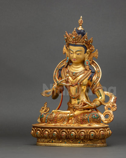 Left view side of Vajrasattva Statue showing sacred vajra and bell in hand
