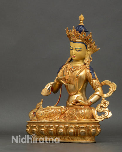 Left view side of Vajrasattva Statue showing vajra and bell hand positions in detail