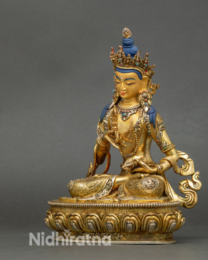 Left view side of Vajrasattva sculpture showing detailed lower garment and semi-precious stones