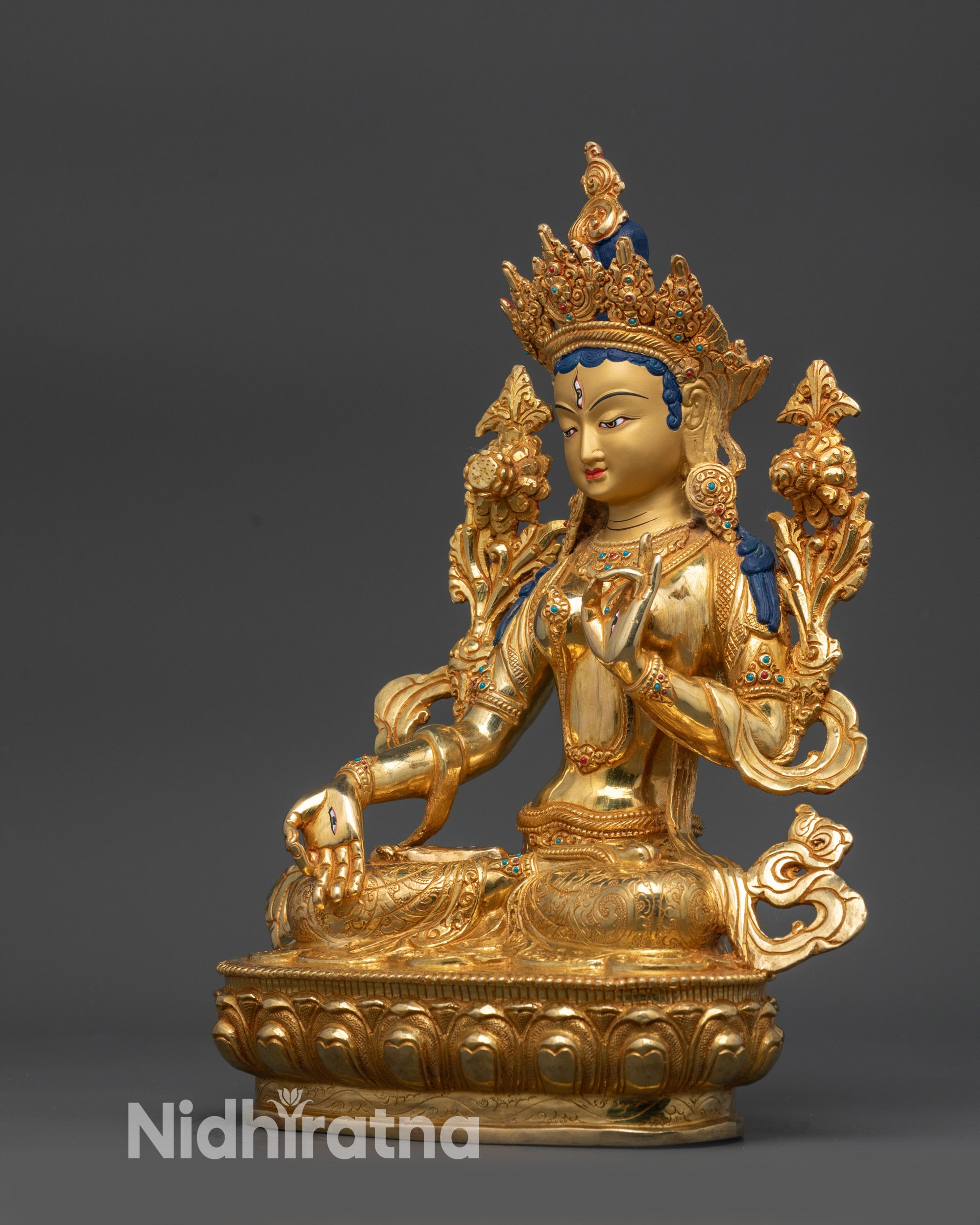 Left view side of White Tara with carved lotus seat, intricate spiritual décor details