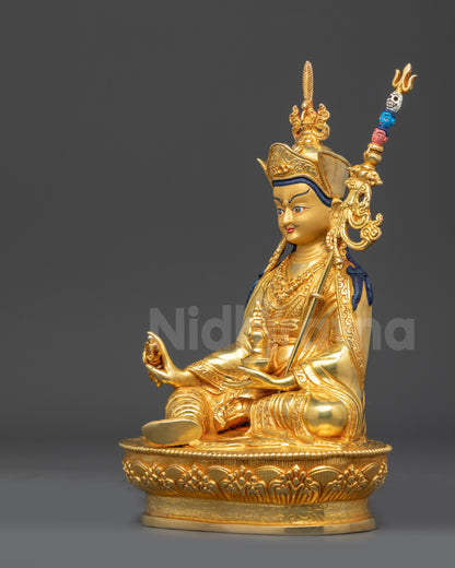 Left view side of gold fire-gilded Guru Padmasambhava seated on lotus throne