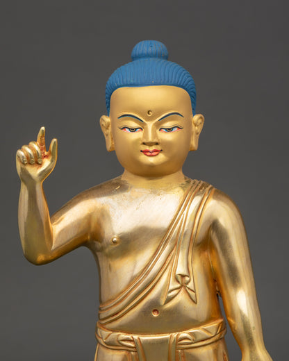 Little Buddha gold-painted face showing peaceful expression and fine details