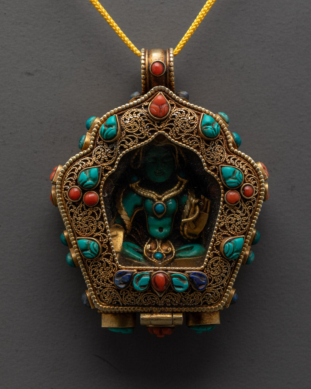 Hand-Carved Green Tara Locket with Vajrayana Buddhist Symbolism