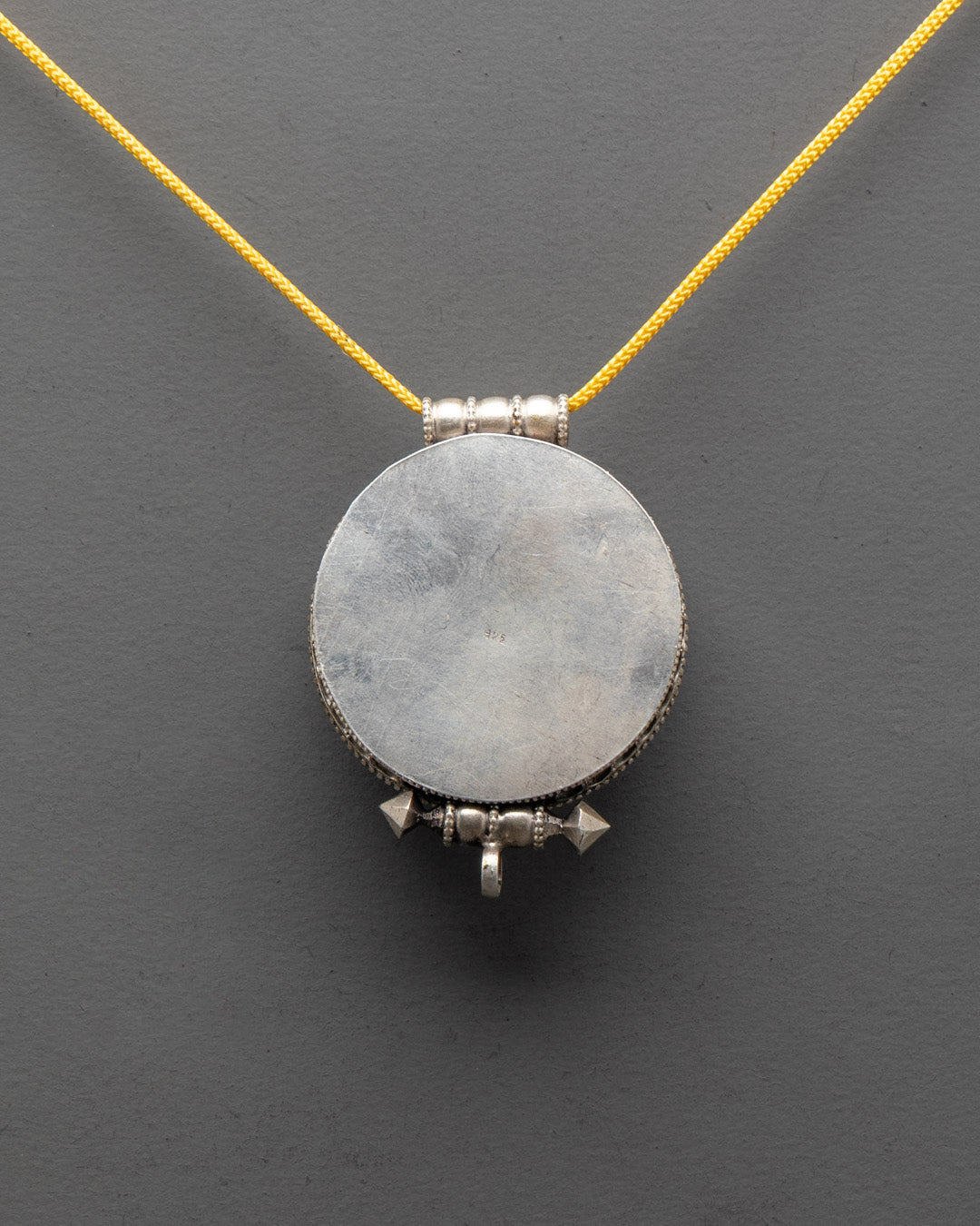 Back view of Bishwo Vajra Locket crafted by Patan artisans, traditional Tibetan jewelry