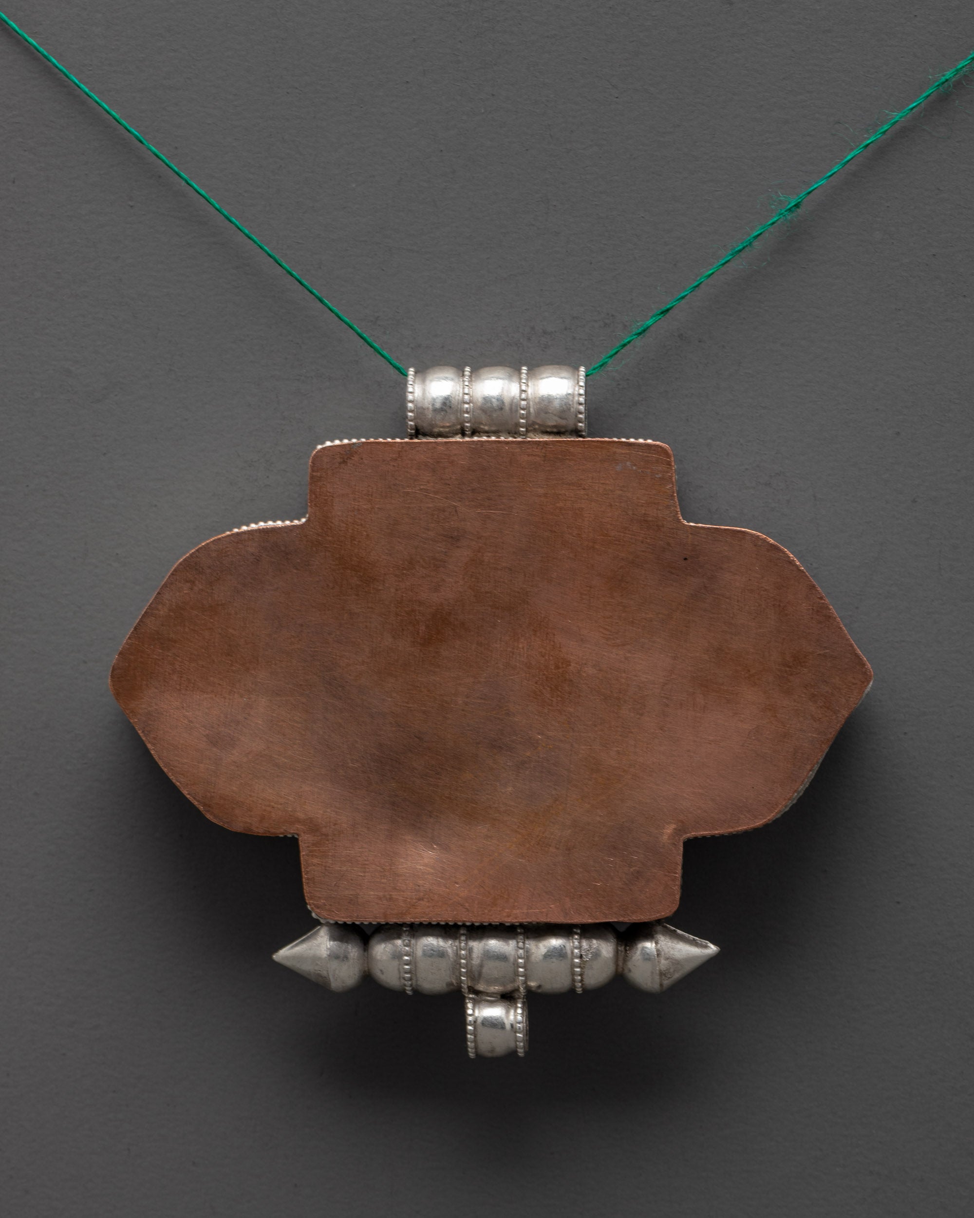Back view of handcrafted Tibetan locket with premium filigree and silver finish