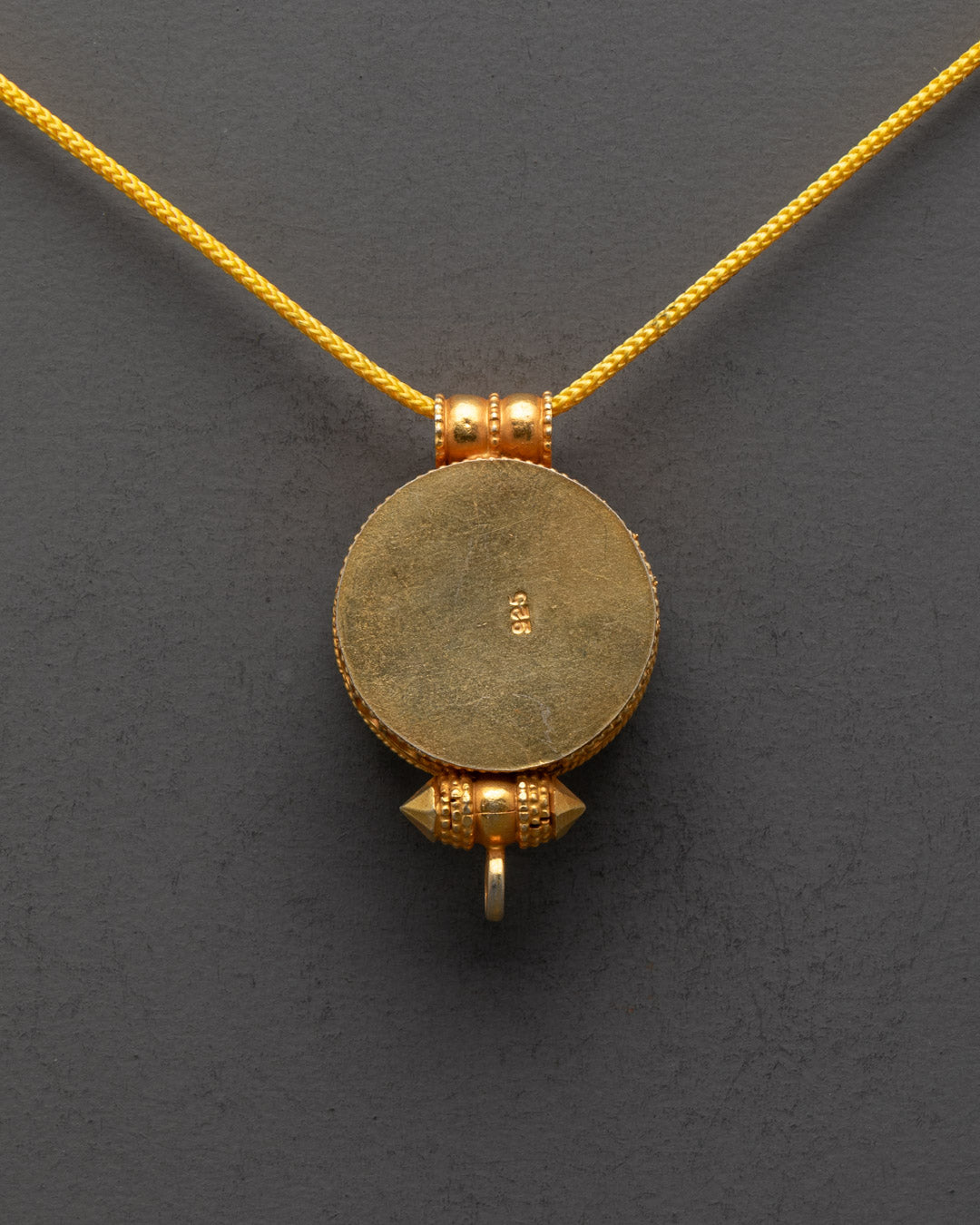 Back view of Gyeltshen Banner Locket handmade by artisans in Patan, Nepal